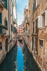 Naklejka na ściany i meble Venice, city of Italy. View of the canal, the Venetian landscape with boats and gondolas