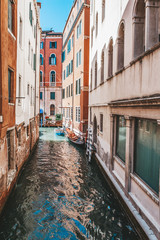 Fototapeta na wymiar Venice, city of Italy. View of the canal, the Venetian landscape with boats and gondolas