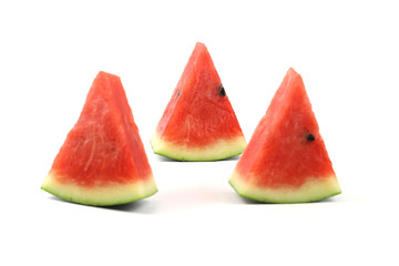 Watermelon slices on white background with selective focus