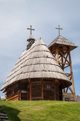 Wooden Orthodox church with bell tower in Drvengrad, Mokra Gora, Serbia. 