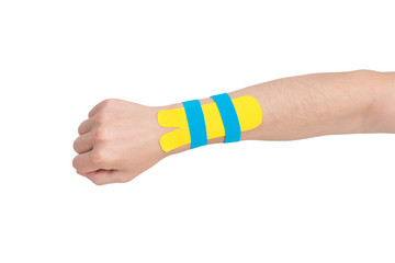 Kinesiology taping on human hand, carpal tunnel syndrome