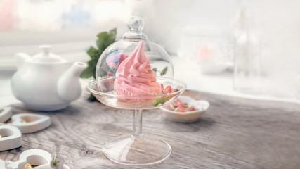 Delicate pink apple marshmallow hand-made in a glass transparent vase. Congratulate. Sign of attention. Marshmallow, dessert. Background.