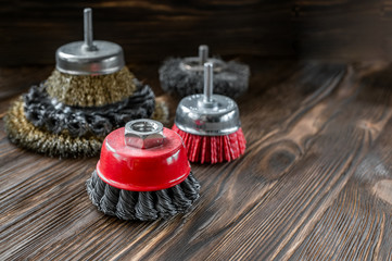 abrasive tools for brushing wood and giving it texture. Wire brushes on treated wood. Copy space