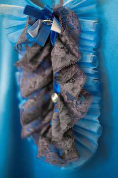 beautiful black lace jabot on blurred blue dress