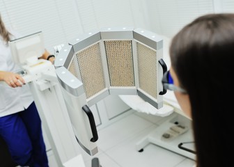 red light therapy. The girl goes through a course of skin rejuvenation with the help of red light...