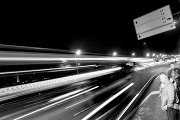 Abstract image of a city at night on a long exposure, road with cars