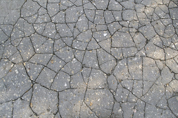 Obraz premium Macro closeup on concrete asphalt cracks on the road