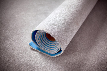 Gray Rolled carpet.