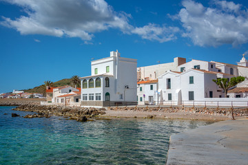 Fototapeta premium White houses by the sea in the villlage of Fornells, Balearic islands, Spain