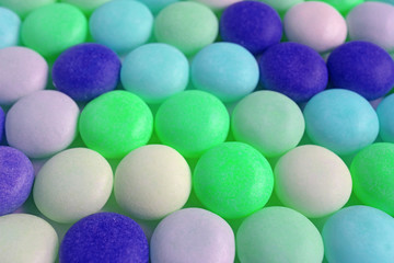 Pow of Bright Green and Blue Colored Round Shaped Candies