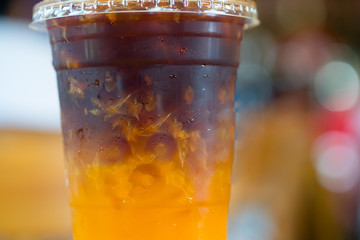 Orange juice espresso with ice. Ice cold summer drink.