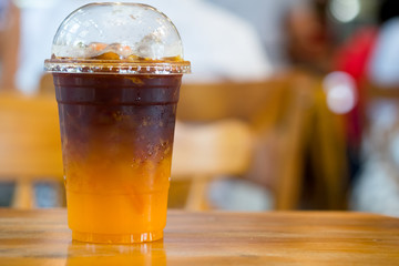 Orange juice espresso with ice. Ice cold summer drink.