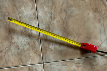 Construction Roulette. Measuring tool. Tape measure. Yellow roulette