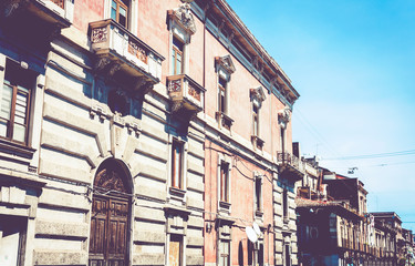 Sicily, entrance door on facade of old baroque building in Catania, traditional architecture of Italy.