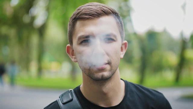 Face of smoking guy closeup