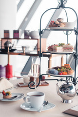 Beautiful english afternoon tea ceremony with desserts