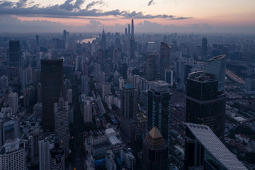 Fototapeta na wymiar Aerial view of business area and cityscape in the dawn, West Nanjing Road, Jing` an district, Shanghai
