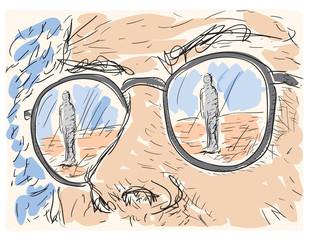 person reflected in the lenses of the glasses