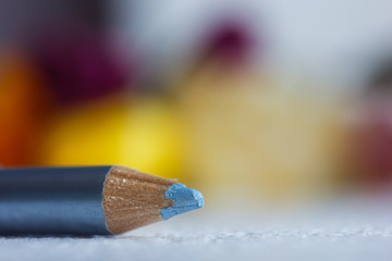 cosmetic pencil for applying makeup on the face close-up. eye liner in macro on blurred background