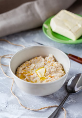Oatmeal porridge with butter for breakfast