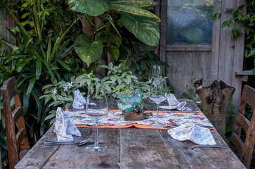 Rustic table set up. Vintage table arrangment on old wooden background.