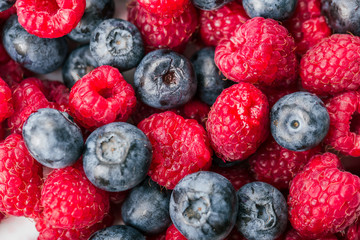 Fresh Summer Berries mix Background with Strawberry, Raspberry, Red currant, Blueberry and Blackberry.