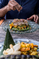 Juicy delicious grilled tuna steak with grilled vegetables and spices