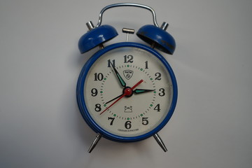 red alarm clock isolated on white background