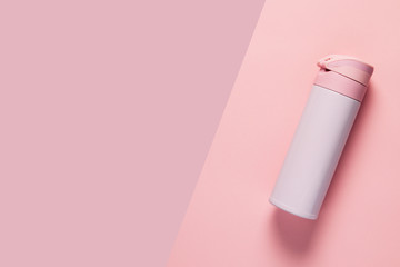Pink thermos on pink background