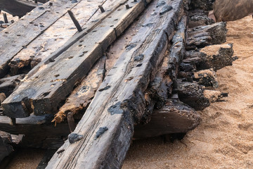 Fototapeta na wymiar This is a picture of an old shipwreck that washed ashore on a Ponte Vedra beach in Florida. The ship is believed to date back as far as the late 1700's. 