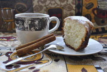 cup of coffee and cake on wooden table