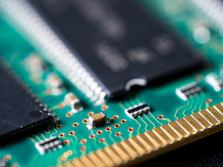 close-up of circuit board with integrated circuits, resistors and capacitors.