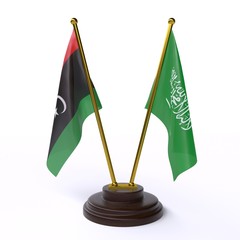 Libya and Saudi Arabia, two table flags isolated on white background. 3d image