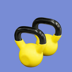 Two yellow kettlebells