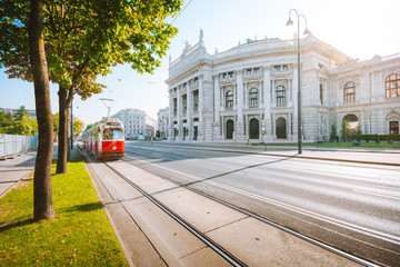 Vienna tram with Burgtheater at sunrise, Vienna, Austria