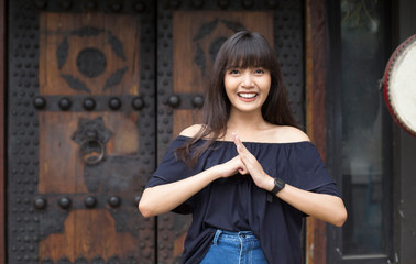 Portrait of smiling young asian woman enjoy  in China town