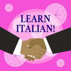 Conceptual hand writing showing Learn Italian. Concept meaning gain or acquire knowledge of speaking and writing Italian Hand Shake Multiracial Male Business Partners Formal Suits