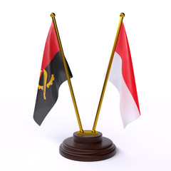 Angola and Indonesia, two table flags isolated on white background. 3d image