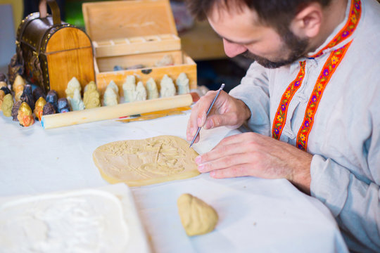 Potter making clay stamp picture