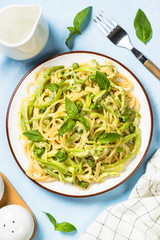 Pasta spaghetti with zucchini top view.