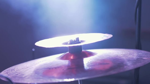 Close up of drum cymbal dramatic lighting stage.