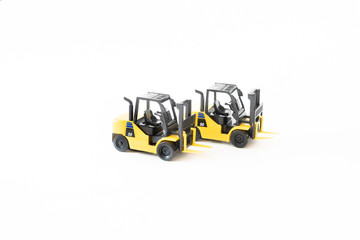 Naklejka premium Two Diesel forklift on white background