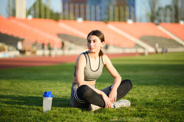 Athletic and beautiful girl resting after a hard workout