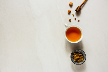 Obraz na płótnie Canvas Chamomile tea on white