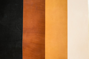 Genuine vegetable tanned leather of 4 color shade texture background