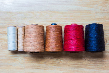 Wax color thread leather crafts woorking on wood background