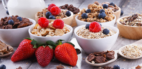 Bowls with different sorts of breakfast cereal products
