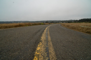 Old paved road into the distance.