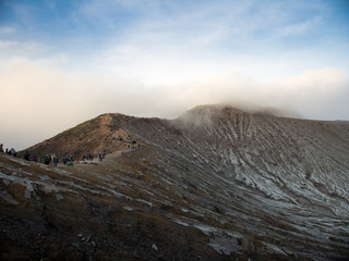 People walking along a Volcanic crater 