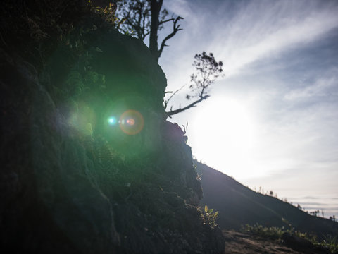 Lens flare from the sun during a mountain trek 